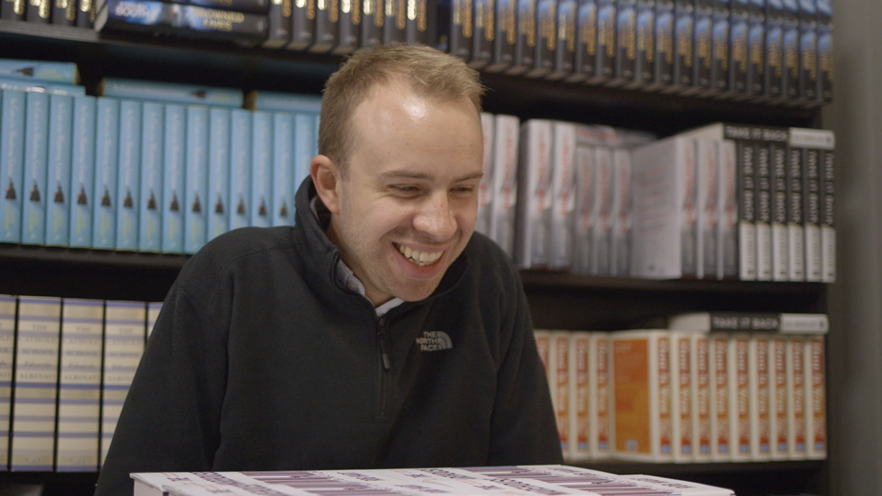 Tom in bookshop with an author